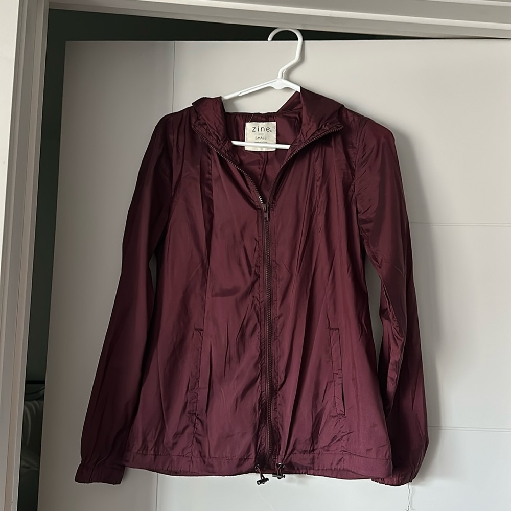 Small maroon wind breaker